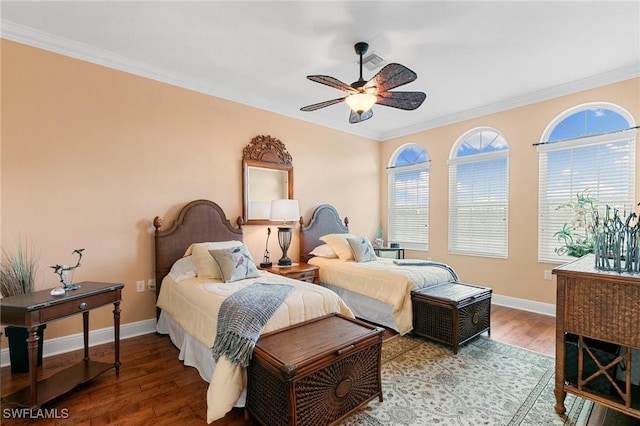 bedroom with baseboards, a ceiling fan, wood finished floors, and crown molding