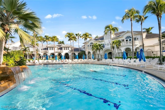 community pool featuring a residential view and a patio