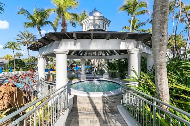 view of home's community featuring a gazebo and a hot tub