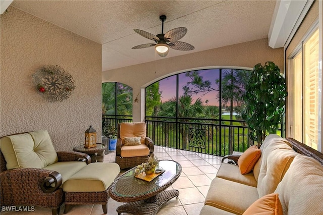 sunroom with a ceiling fan