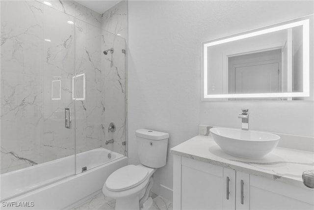 7014 Alfa Cir, Labelle, FL 33935 - full bath with marble finish flooring, toilet, vanity, and bath / shower combo with glass door