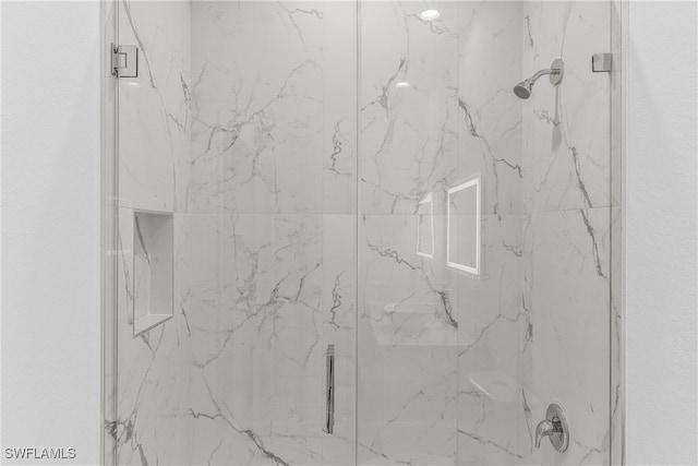 interior details with an enclosed shower