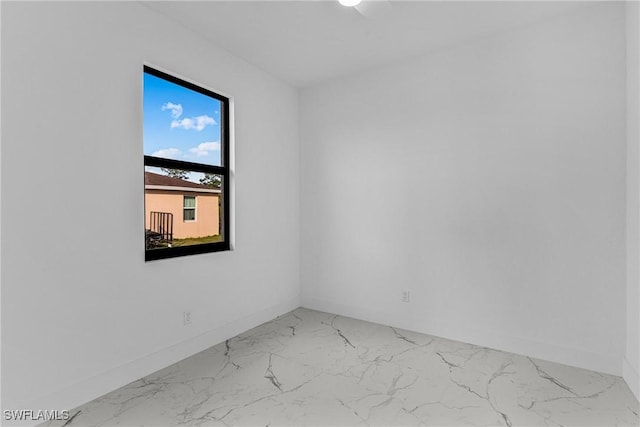 7014 Alfa Cir, Labelle, FL 33935 - unfurnished room with marble look tile flooring and baseboards