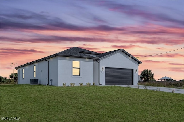 7014 Alfa Cir, Labelle, FL 33935 - view of front of property with concrete driveway, stucco siding, a garage, and a front lawn