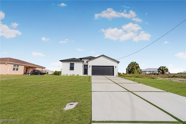 7014 Alfa Cir, Labelle, FL 33935 - view of front facade featuring concrete driveway, an attached garage, a front lawn, and stucco siding