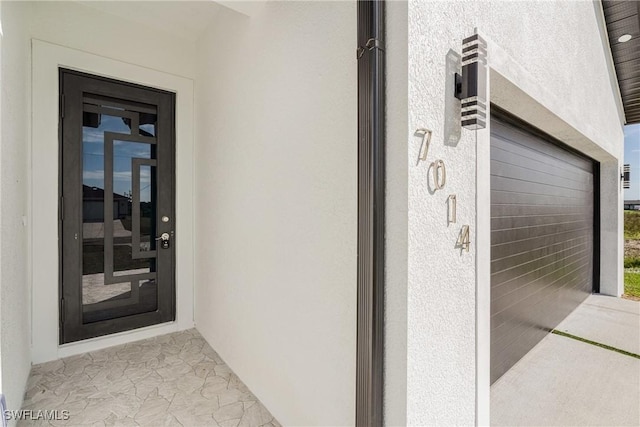 7014 Alfa Cir, Labelle, FL 33935 - entrance to property with stucco siding and a garage