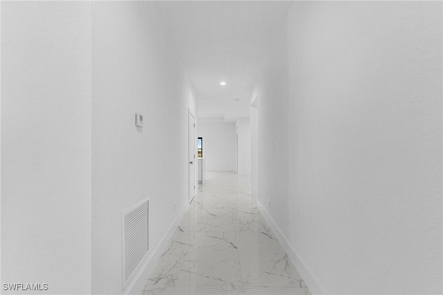 7014 Alfa Cir, Labelle, FL 33935 - corridor with light marble finish flooring, recessed lighting, and baseboards