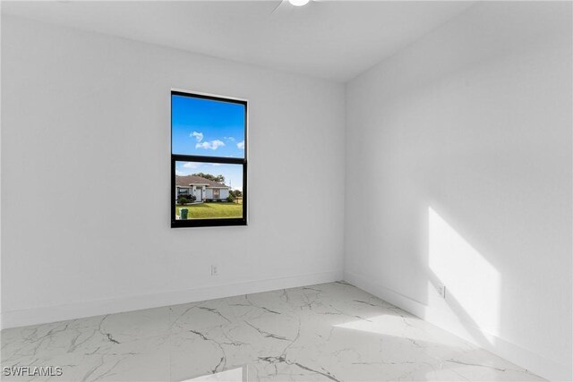7014 Alfa Cir, Labelle, FL 33935 - empty room with baseboards and marble finish flooring