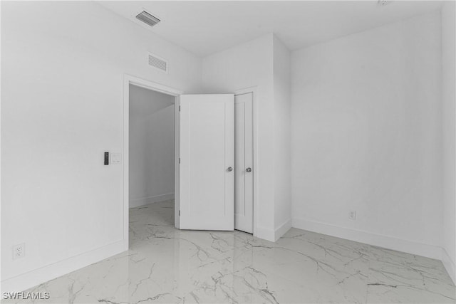 7014 Alfa Cir, Labelle, FL 33935 - unfurnished room featuring marble finish flooring and baseboards