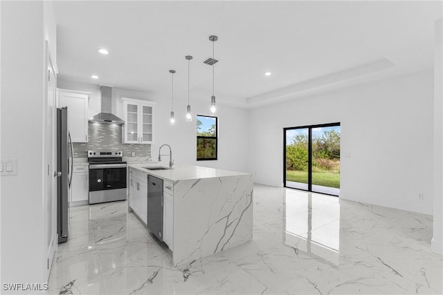 7014 Alfa Cir, Labelle, FL 33935 - kitchen with appliances with stainless steel finishes, wall chimney range hood, a sink, light marble finish floors, and plenty of natural light