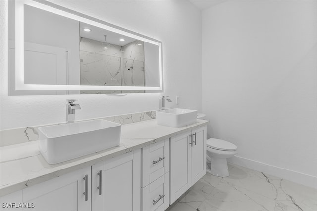 bathroom with vanity, toilet, and a shower with shower door