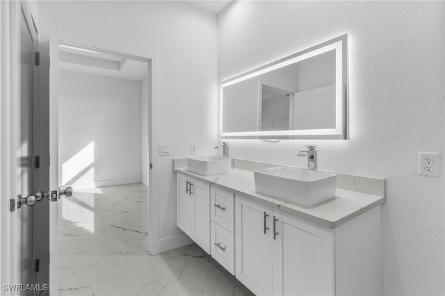 7014 Alfa Cir, Labelle, FL 33935 - bathroom with marble look tile flooring, double vanity, and baseboards