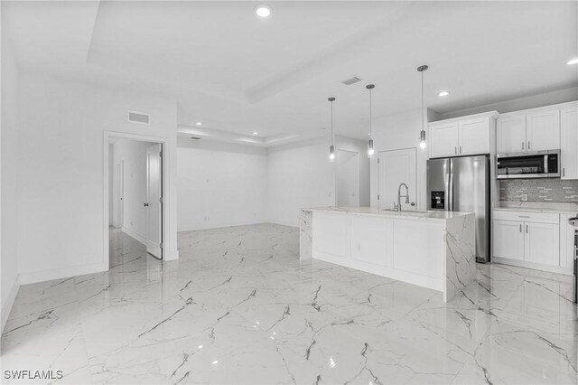 7014 Alfa Cir, Labelle, FL 33935 - kitchen with stainless steel appliances, recessed lighting, a sink, decorative backsplash, and open floor plan
