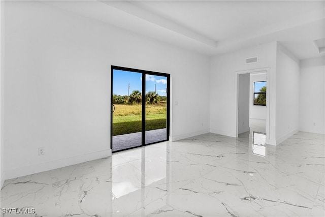 7014 Alfa Cir, Labelle, FL 33935 - spare room featuring plenty of natural light, baseboards, and light marble finish floors