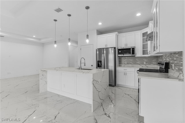 kitchen featuring appliances with stainless steel finishes, a center island with sink, white cabinetry, and sink