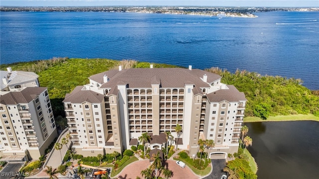 birds eye view of property featuring a water view