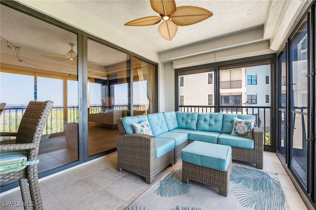 sunroom / solarium with ceiling fan and a healthy amount of sunlight