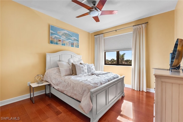 bedroom featuring dark hardwood / wood-style floors and ceiling fan