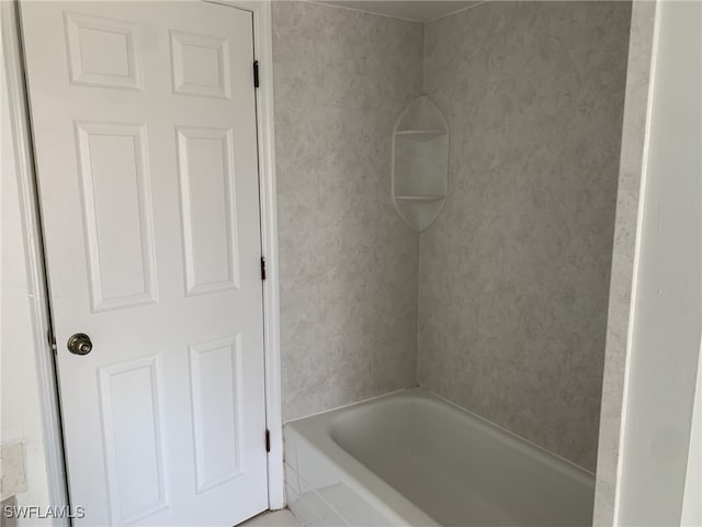 bathroom featuring a tub to relax in