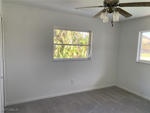 unfurnished room with carpet and ceiling fan