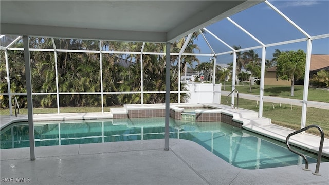 view of swimming pool featuring glass enclosure and an in ground hot tub