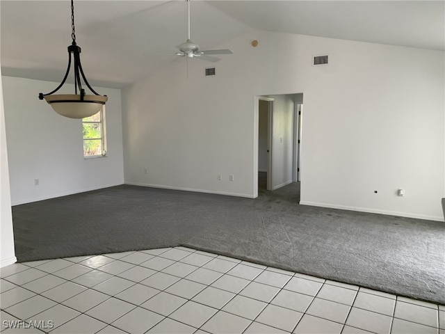 unfurnished room with light carpet, ceiling fan, and vaulted ceiling