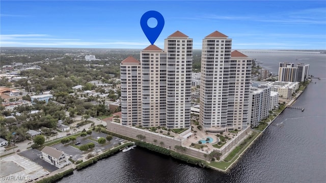 birds eye view of property featuring a water view