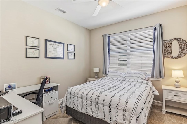 bedroom with baseboards, visible vents, ceiling fan, and carpet flooring