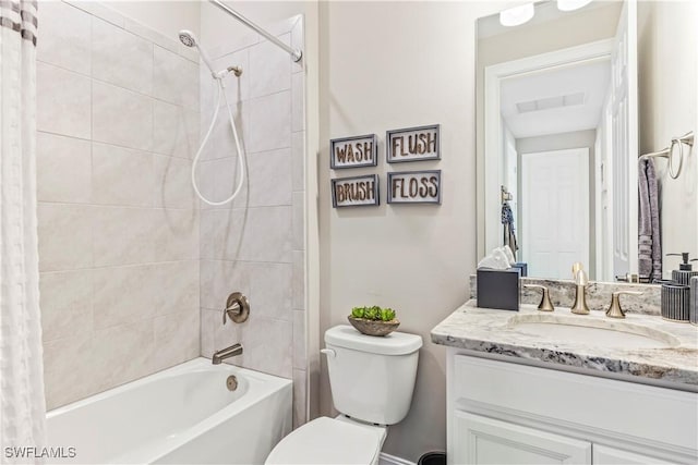 bathroom featuring toilet, visible vents, shower / tub combo with curtain, and vanity