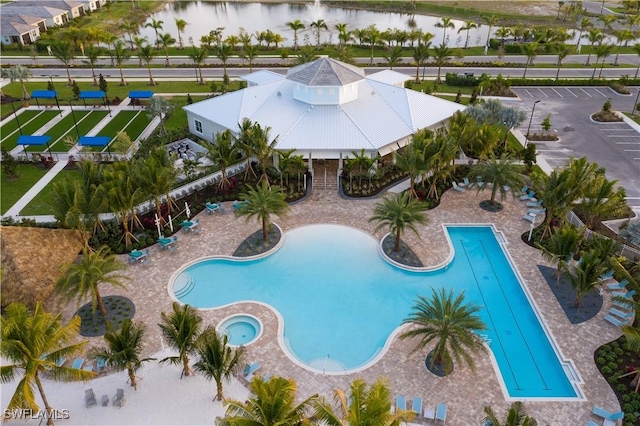 view of swimming pool with a water view