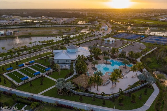 aerial view at dusk with a water view