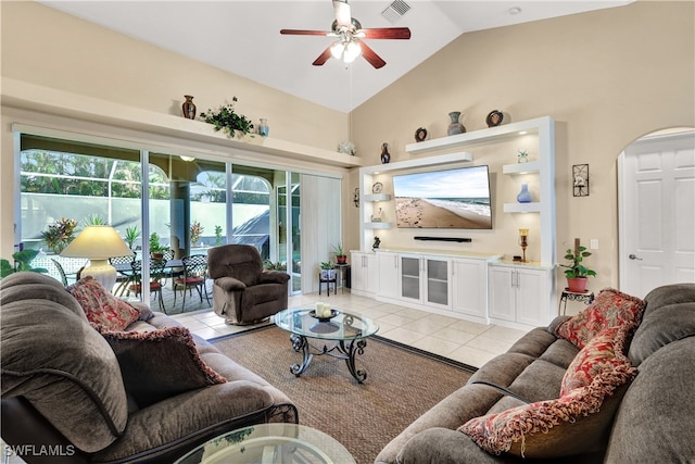 living room featuring ceiling fan, light tile patterned floors, and high vaulted ceiling