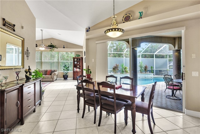 dining room with vaulted ceiling, ceiling fan, and light tile patterned flooring