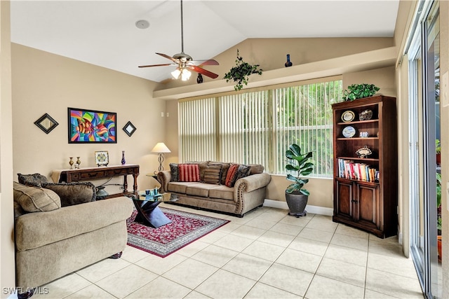 tiled living room featuring ceiling fan and vaulted ceiling