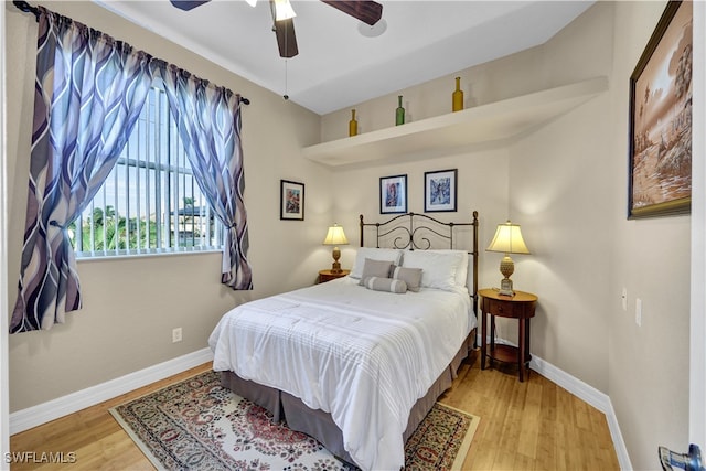 bedroom with hardwood / wood-style floors and ceiling fan