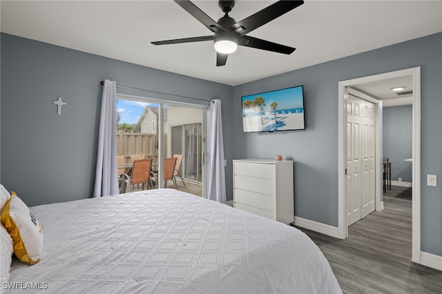 bedroom featuring hardwood / wood-style floors, ceiling fan, access to outside, and a closet