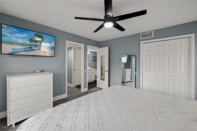 unfurnished bedroom featuring ceiling fan, a closet, ensuite bathroom, and dark hardwood / wood-style floors