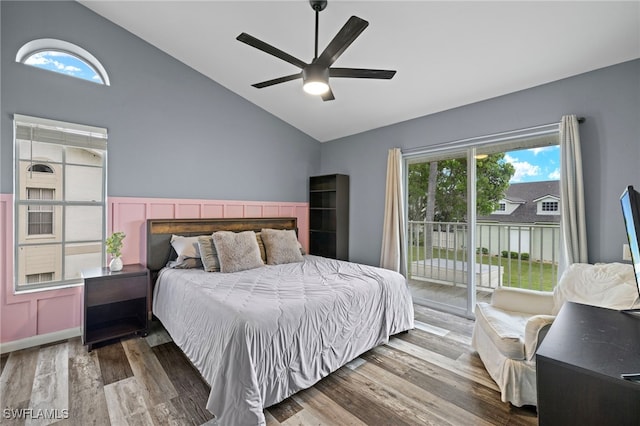 bedroom featuring multiple windows, ceiling fan, wood-type flooring, and access to exterior