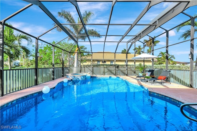 view of swimming pool featuring an in ground hot tub, a patio area, and a lanai