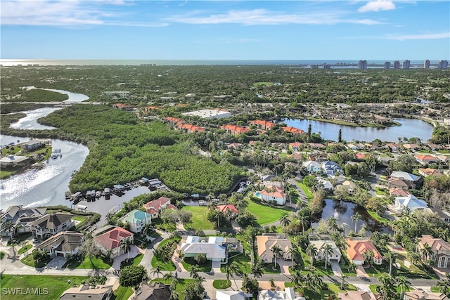 birds eye view of property featuring a water view