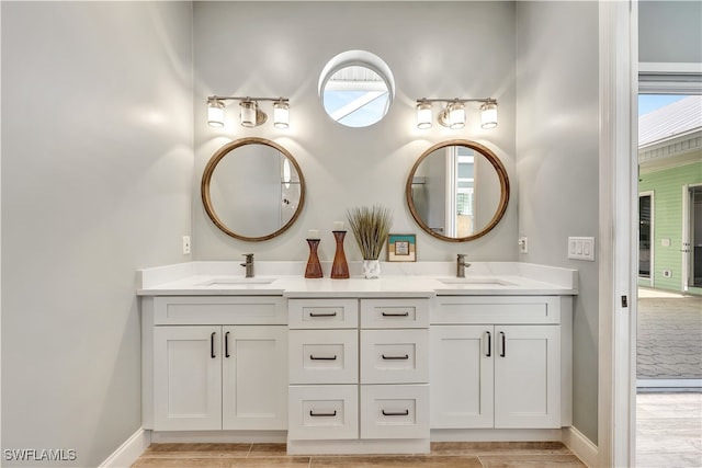 bathroom with hardwood / wood-style floors and vanity