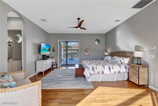 bedroom with access to exterior, wood-type flooring, and ceiling fan