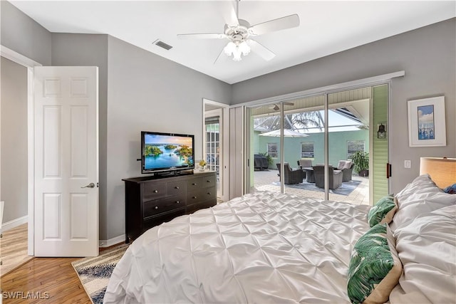 bedroom with baseboards, access to outside, visible vents, and light wood-style floors