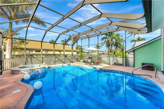 view of swimming pool featuring a patio area and a lanai