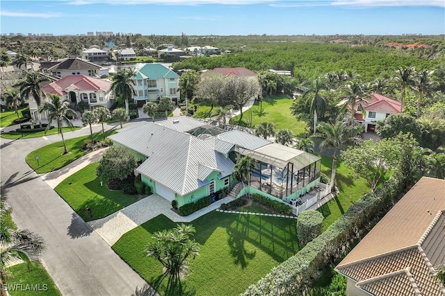 birds eye view of property with a residential view