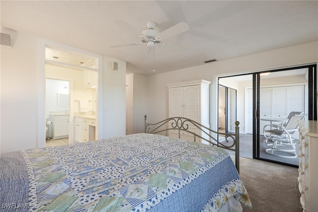 bedroom featuring carpet, ceiling fan, sink, and ensuite bathroom