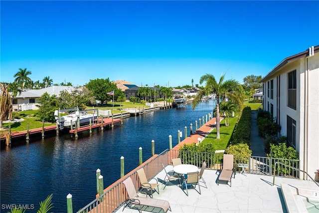 4914 Tudor Dr Unit 203, Cape Coral, FL 33904 - view of patio with a water view and a dock