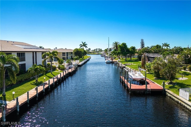 property view of water with a dock