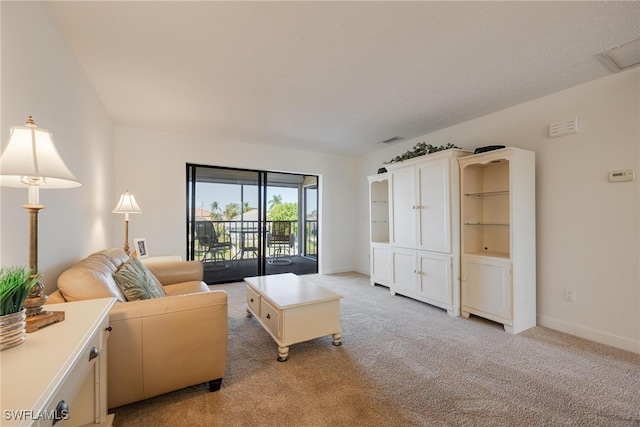 living room featuring light carpet