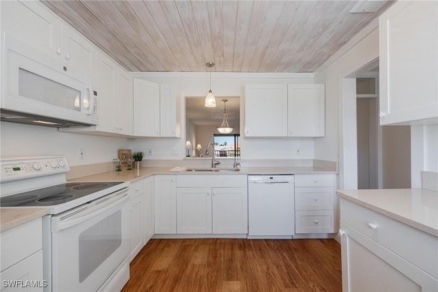 kitchen with white cabinets, dark hardwood / wood-style flooring, white appliances, and sink